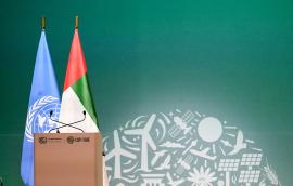 View of a lectern with flags of the United Nations and the United Arab Emirates