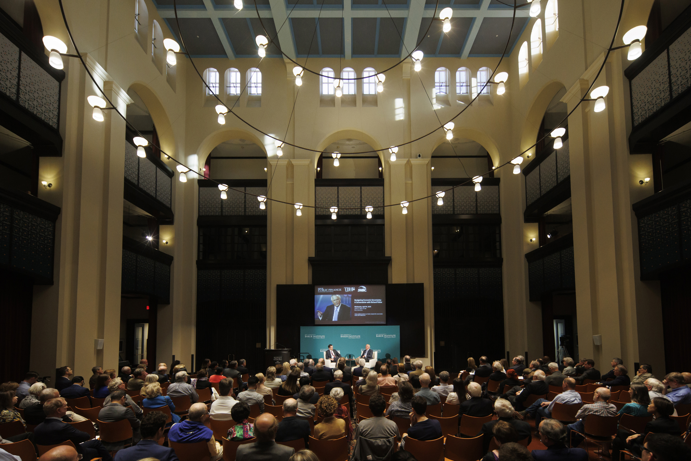 The audience gathers in Baker Hall's Doré Commons for a conversation with Richard Fisher