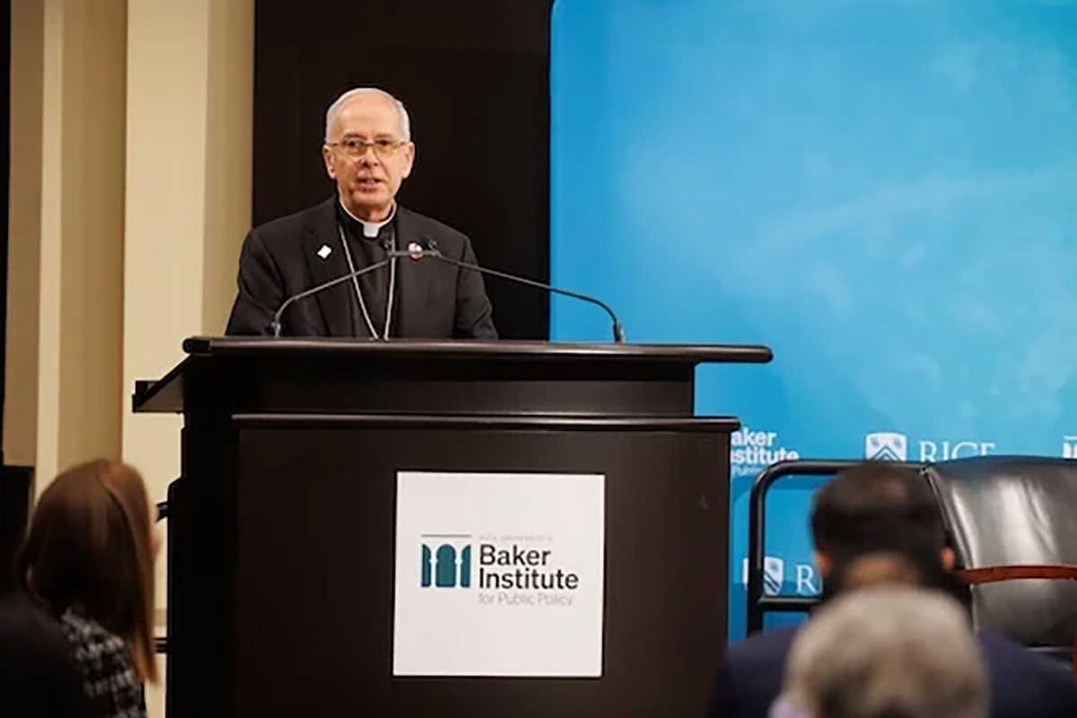 Mark Seitz, bishop of the Catholic Diocese of El Paso, speaks from podium 