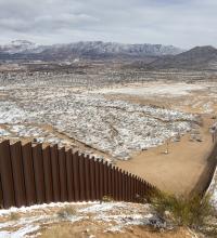 Snowy view of U.S.-Mexico border wall between Ciudad Juárez and El Paso