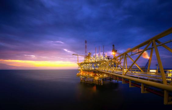 Offshore oil platform at sunrise/sunset