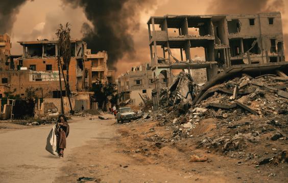 Walking in destroyed city, a little girl seeks shelter
