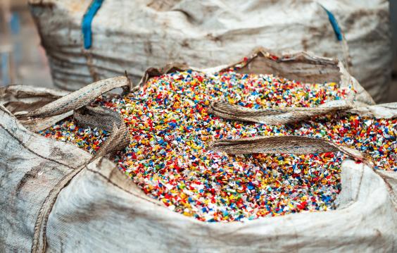 Shredded plastic garbage at waste recycling factory