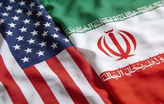 Close up view of the draped national flags representing the United States and Iran illustrating diplomatic relations issues.