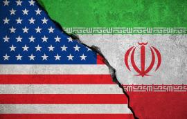 The flags of the U.S. and Iran fusing together as stone.