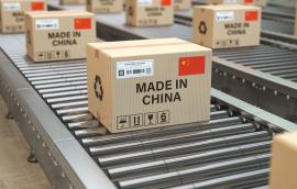 Boxes labeled "MADE IN CHINA" move along a production line.