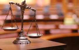 Unbalanced scales of justice.