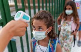 Student gets temperature checked at school