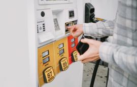 A person pays for gas at the pump.