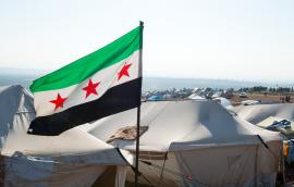 The Syrian revolution flag waves over refugee camps.