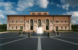 The front of Baker Hall, from across the plaza, with fountain in foreground