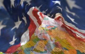 US flag drapes around Middle East regional map