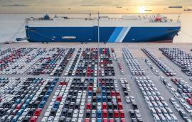 Aerial view vehicle carrier vessel loading car for shipping to worldwide, Large RoRo (Roll on/off) vehicle car carrier, New car lined up in the port for import export around the world.