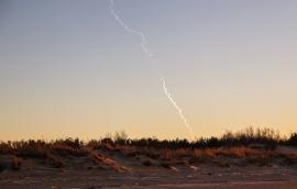 Missile trail in sky
