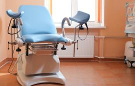 Gynecological exam chair in doctor's office