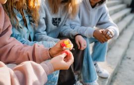 Children holding weed gummies