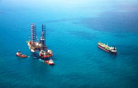 Oil rigs sitting in the ocean