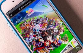 image of anime game on a mobile phone