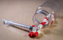 Pills and syringe