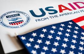 USAID logo letterhead and US flag in foreground 
