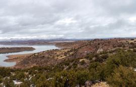 Red rocks around a reservoir