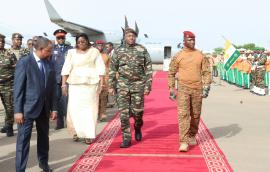 military officers on red carpet at airport
