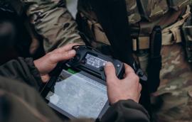 A group of Ukrainian military using tablet to operate the drone.