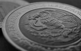 Coin of 5 Mexican pesos close-up. Peso of Mexico. Reverse of coin with coat of arms of country. 