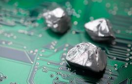 rare mineral rocks on green circuit board