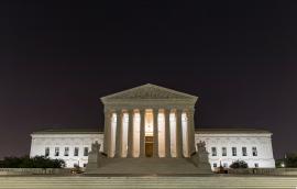 U.S. Supreme Cout Building at night under the crescent moon, Washington D.C.