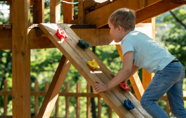 Child at play on colorful playground equipment