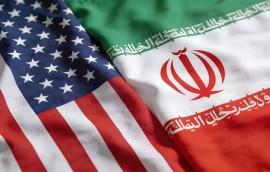 Close up view of the draped national flags representing the United States and Iran illustrating diplomatic relations issues.