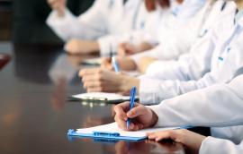 Medical workers working in conference room.