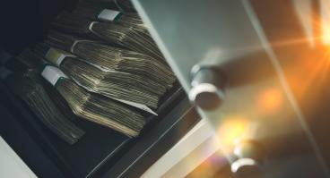 Money sits in a bank safe.