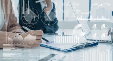Person looking at graphs and charts