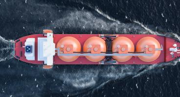A gas tanker moves through a body of water.