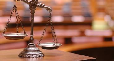 Unbalanced scales of justice.