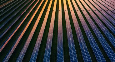 This photo shows an aerial view of solar panels.