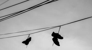 Shoes hang from a power line.
