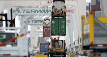 Trucks transport cargo across the U.S.-Mexico border