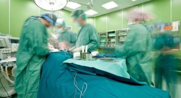 Surgeons operate on patient