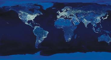 The globe at night, lights in populated areas illuminated