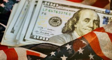 American flag envelopes stack of $100 bills