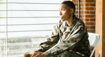 Solider sitting in folding chair