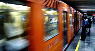 People wait for the subway in Mexico City.