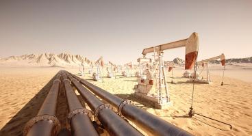 Pump jacks and pipelines move oil through the desert