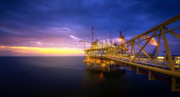 Offshore oil platform at sunrise/sunset