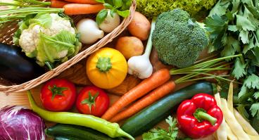 Table full of fresh vegetables and produce