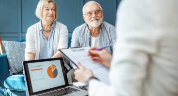 An elderly couple discusses their finances.
