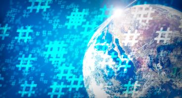 Hashtags overlay the Earth.